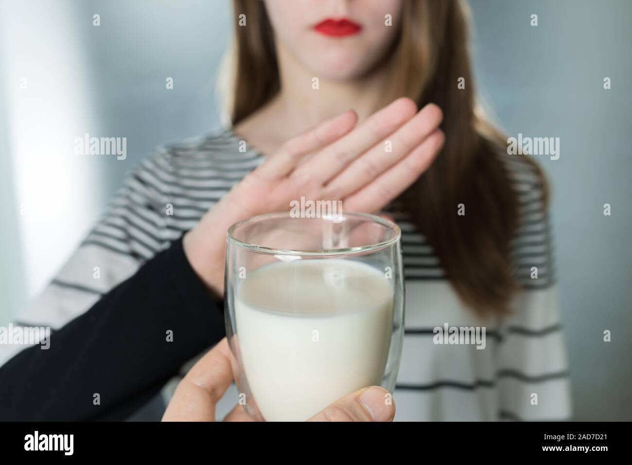 Lactose intolerance. Dairy Intolerant young girl refuses to drink milk