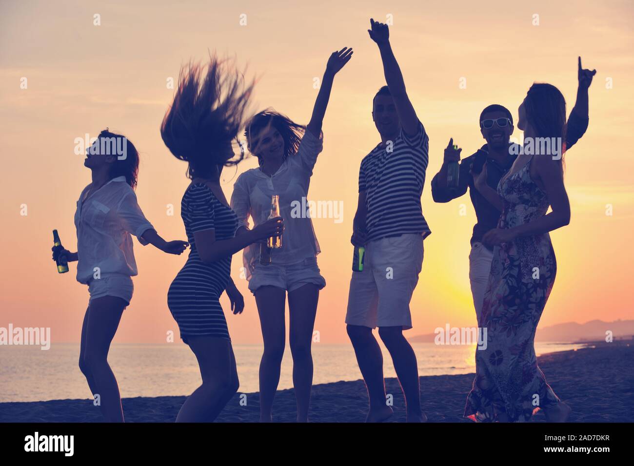 Group of young people enjoy summer  party at the beach Stock Photo