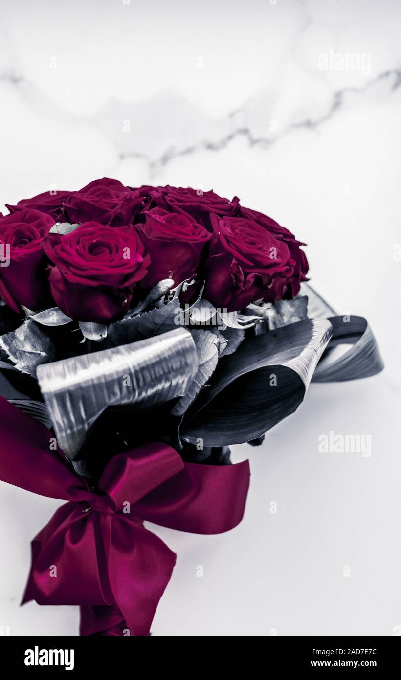 Gift for her, romantic relationship and floral design concept - Luxury  bouquet of maroon roses on marble background, beautiful flowers as holiday  love Stock Photo - Alamy