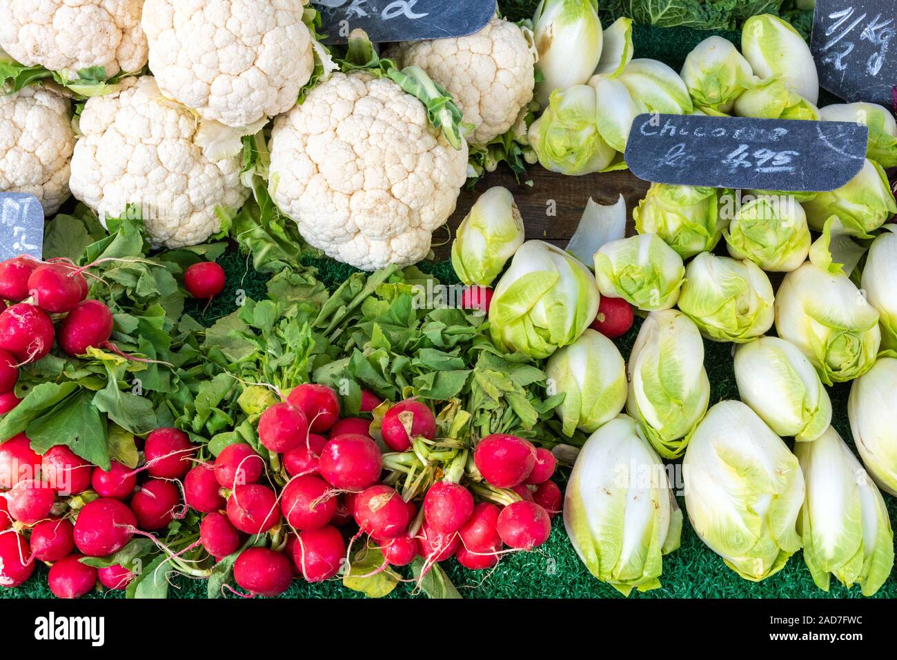 Radish, cauliflower and chicory for sale at a market Stock Photo
