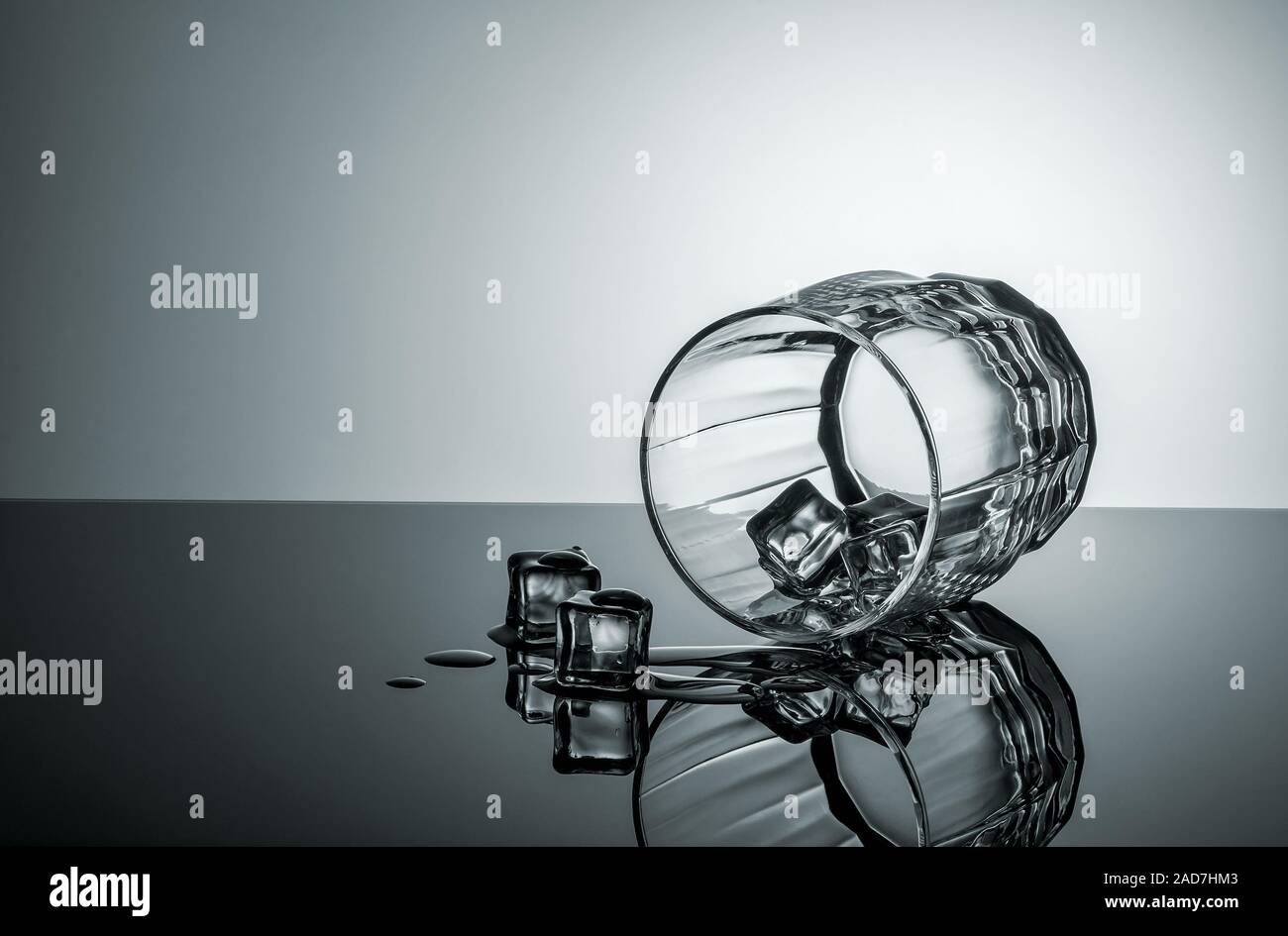 Lying glass with ice cubes Stock Photo