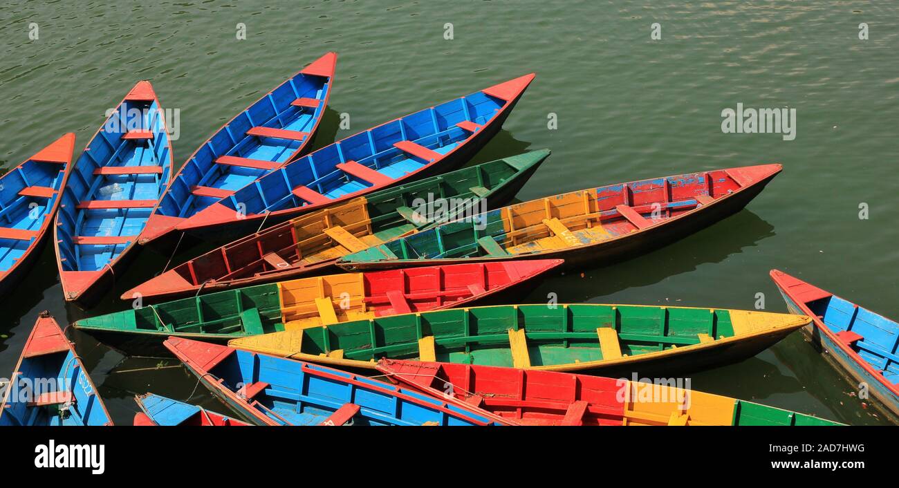 Multi colored timber rowing boats on Fewa lake, Pokhara, Nepal Stock ...