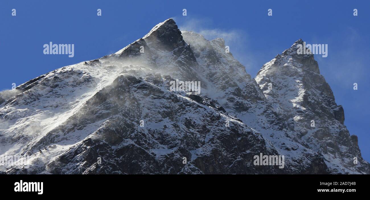 Scene in the Langtang valley Nepal. Wind blowing snow over mountain ...