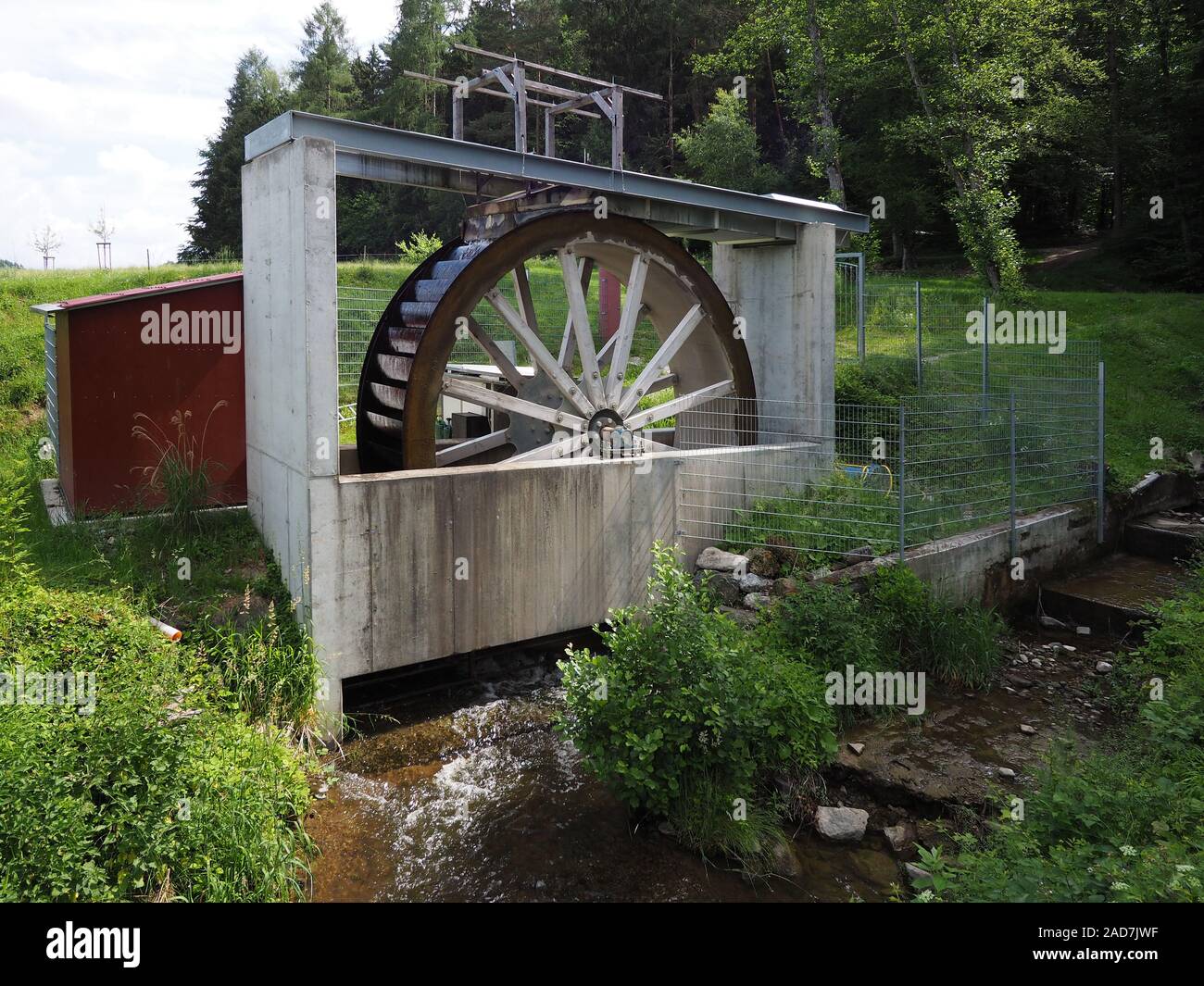Modern water wheel for electricity production Stock Photo Alamy