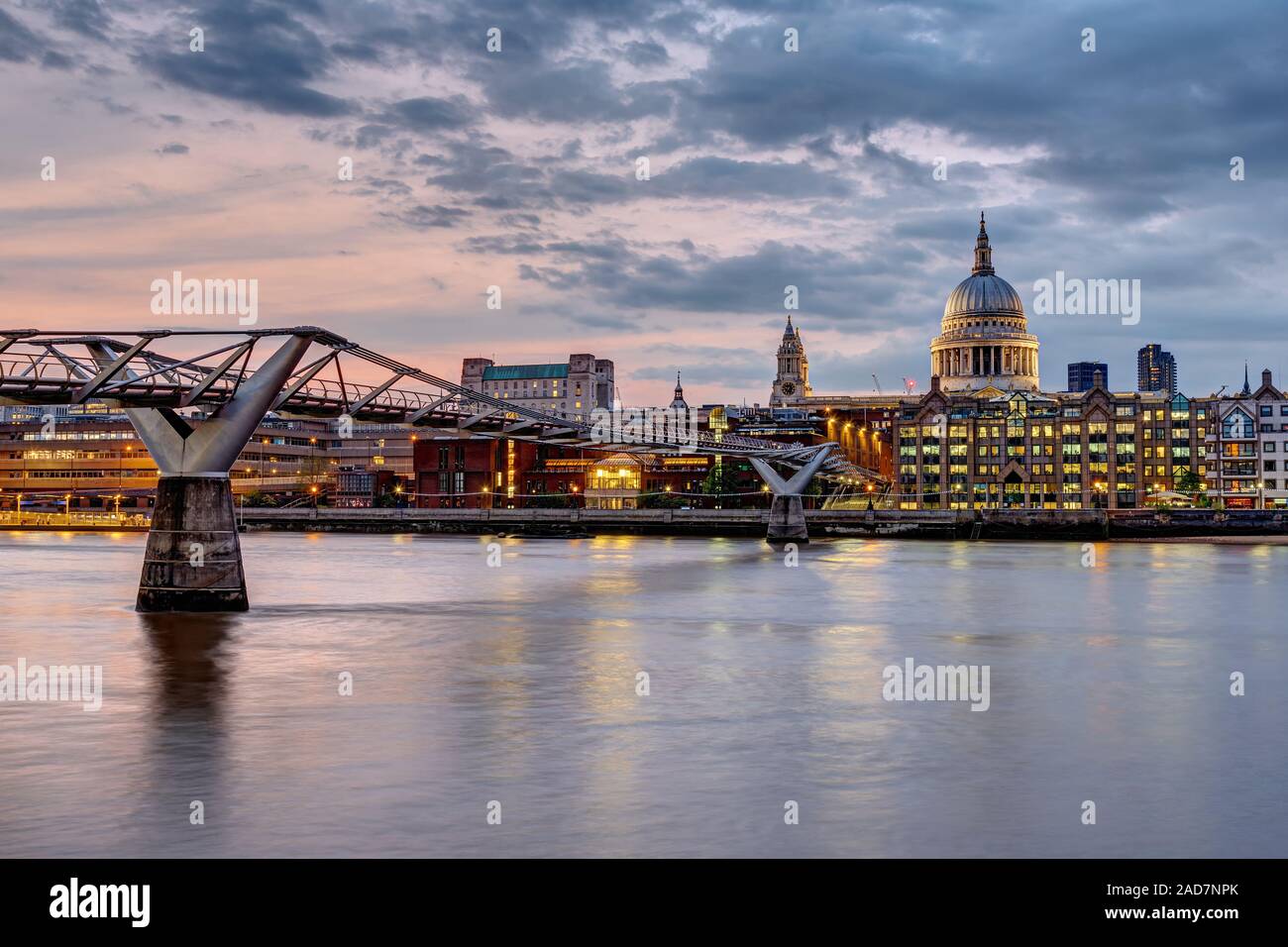 The Millennium Bridge and St. Paul's cathedral in London, UK, at sunset Stock Photo