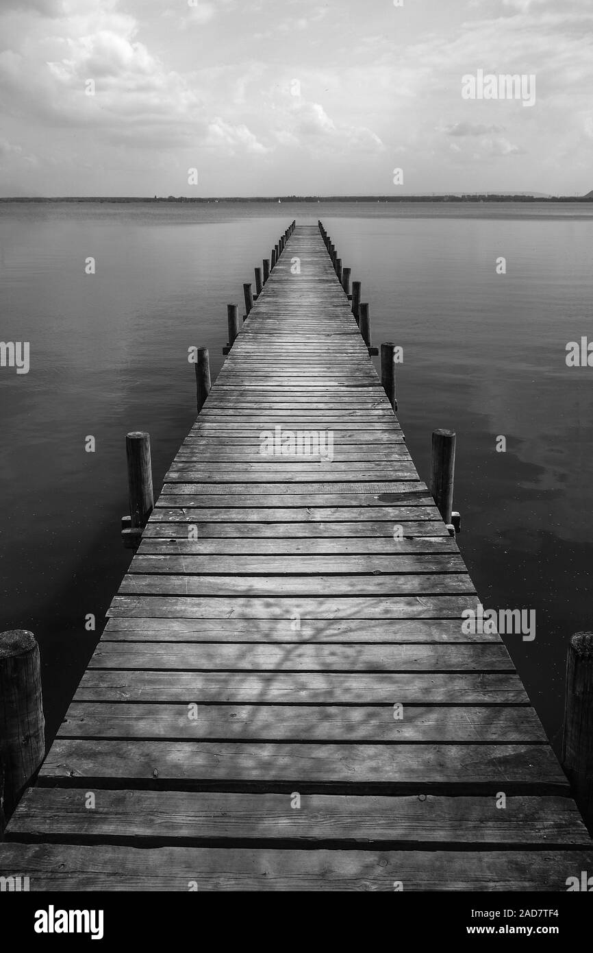 Wooden pier at silence lake, monochrome shoot Stock Photo
