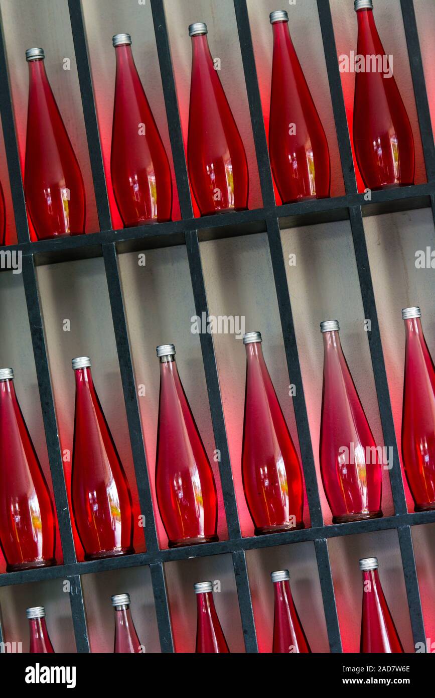 bottles of red juice in modern restaurant Stock Photo