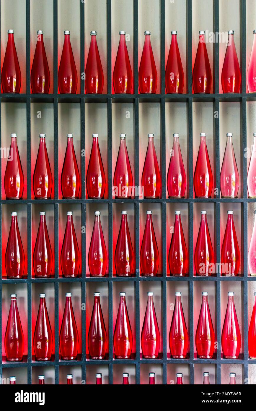 bottles of red juice in modern restaurant Stock Photo