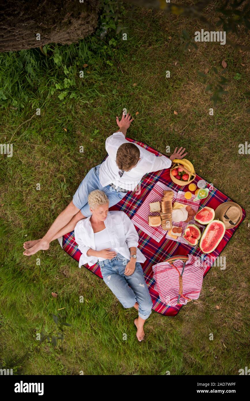 top view of couple enjoying picnic time Stock Photo - Alamy