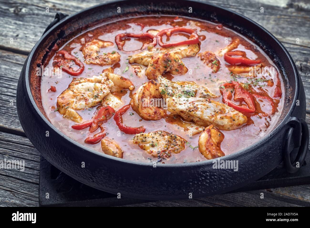 Traditional Creole cajun court bouillon with fish and seafood gumbo chowder stew as top view in