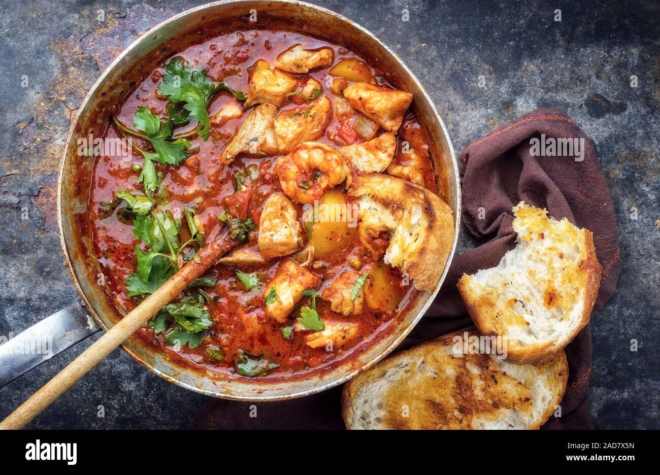 Traditional Creole cajun court bouillon with fish and seafood gumbo chowder stew as top view in