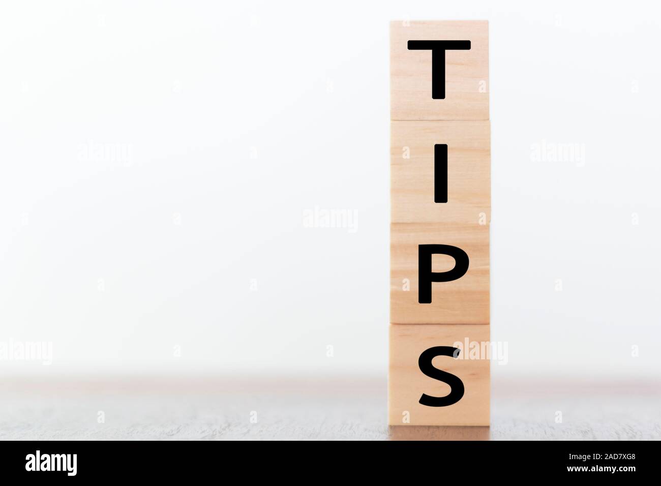 Tips written on wooden cubes with copy space Stock Photo