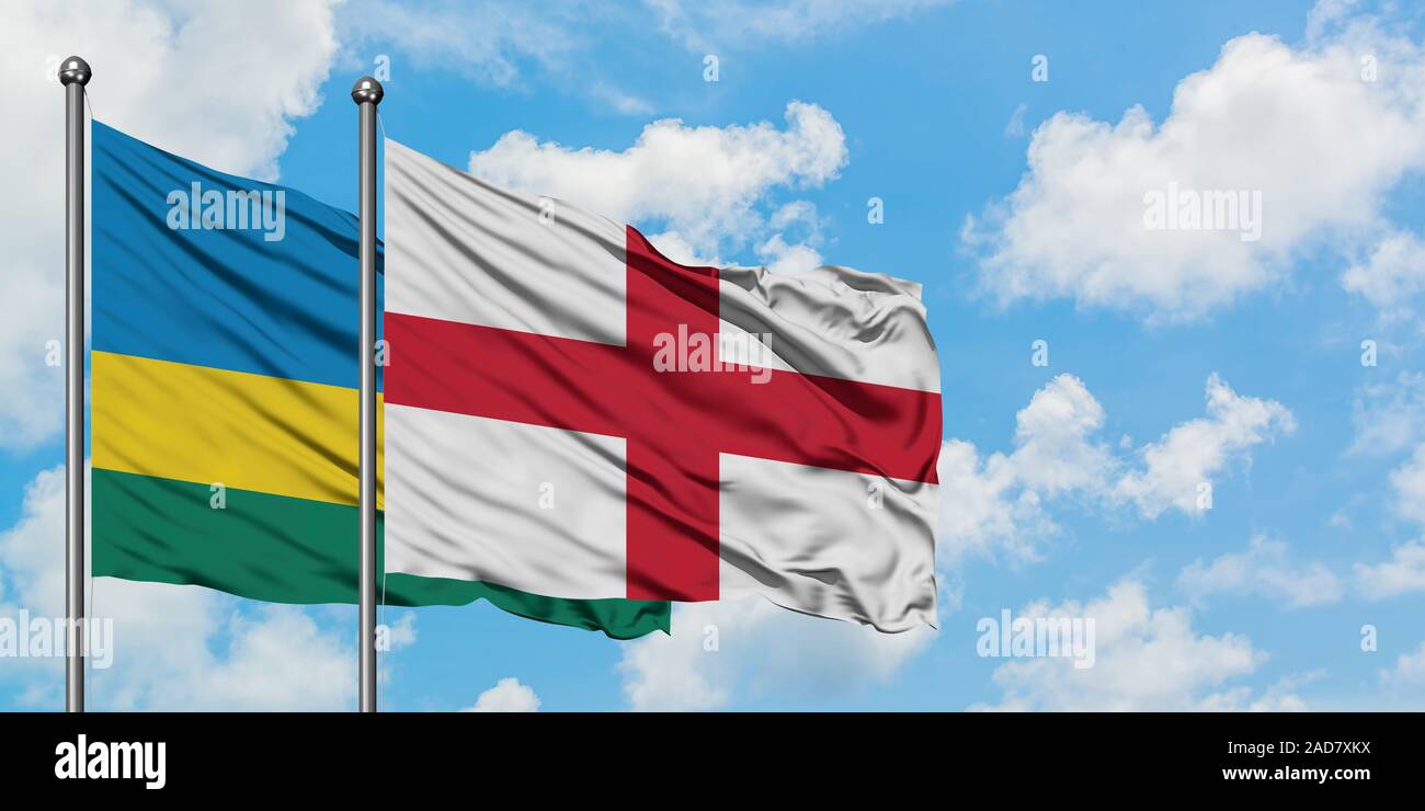 England And Rwanda Rwanda and England flag waving in the wind against white cloudy blue ...