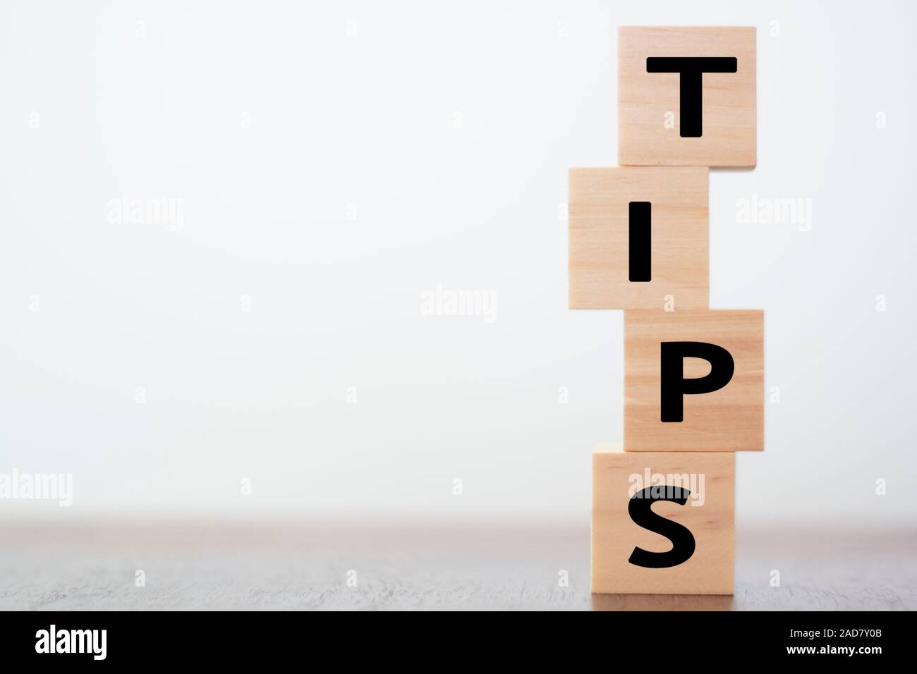 Tips written on wooden cubes with copy space Stock Photo