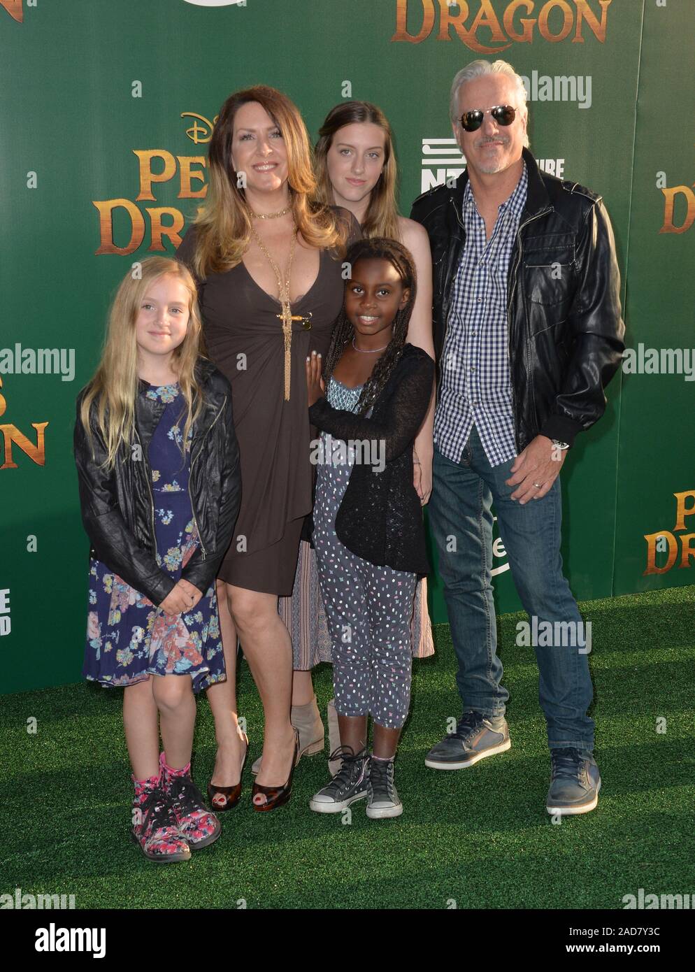 LOS ANGELES, CA. August 8, 2016: Actress Joely Fisher & husband Christopher Duddy & daughters True, Olivia & Skylar at the world premiere of Disney's 'Pete's Dragon' at the El Capitan Theatre, Hollywood. © 2016 Paul Smith / Featureflash Stock Photo
