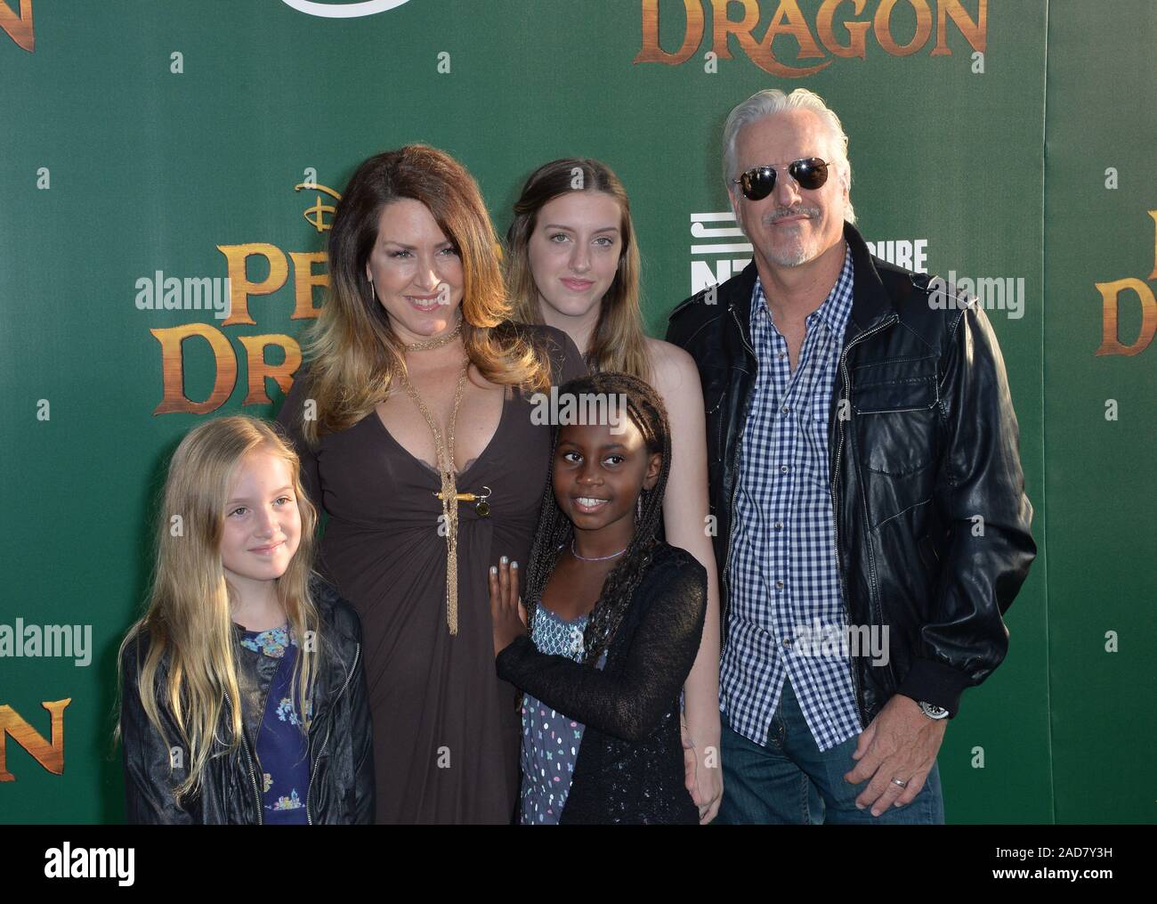 LOS ANGELES, CA. August 8, 2016: Actress Joely Fisher & husband Christopher Duddy & daughters True, Olivia & Skylar at the world premiere of Disney's 'Pete's Dragon' at the El Capitan Theatre, Hollywood. © 2016 Paul Smith / Featureflash Stock Photo