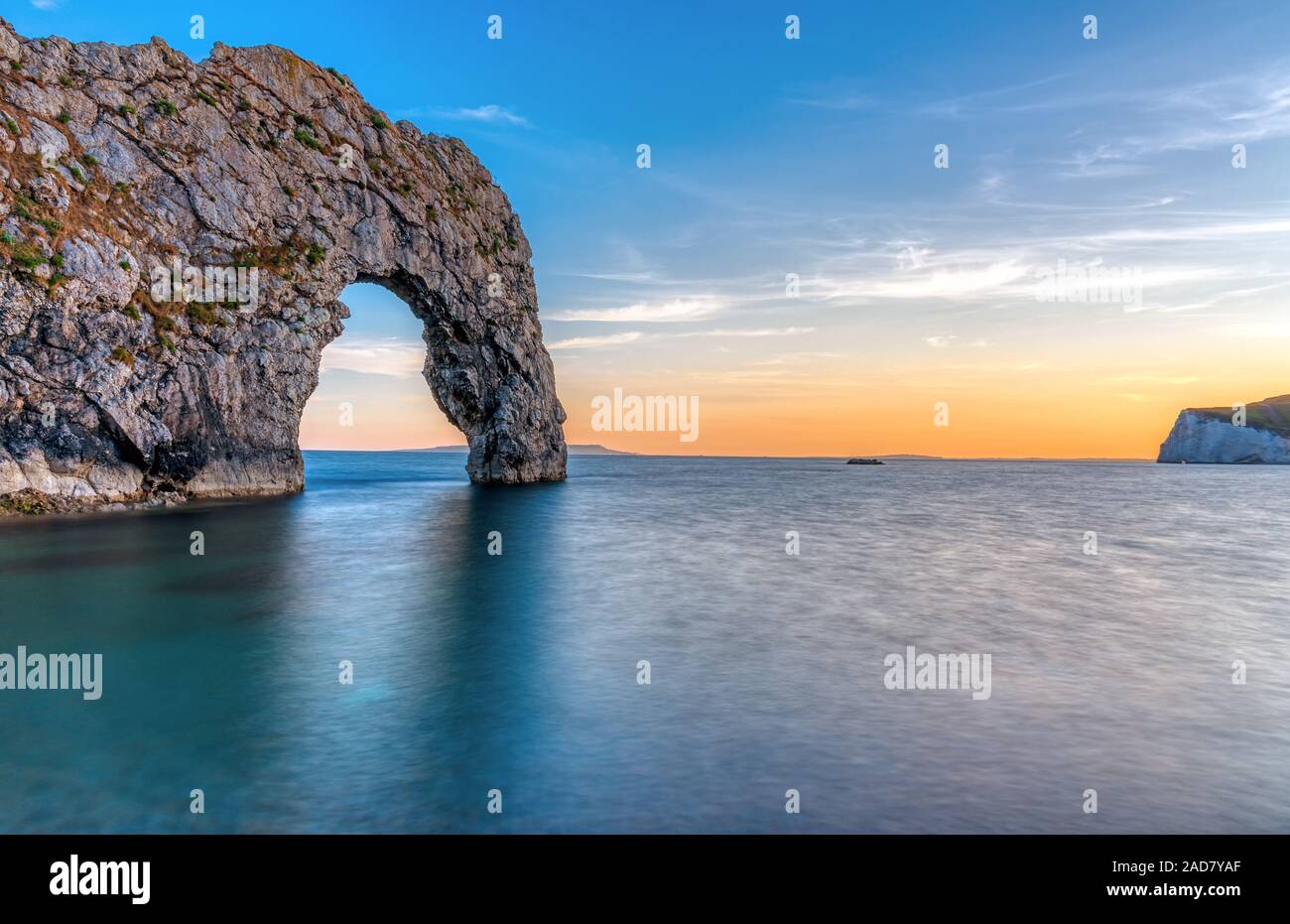 The Durdle door at the Jurassic Coast in Dorset after sunset Stock Photo