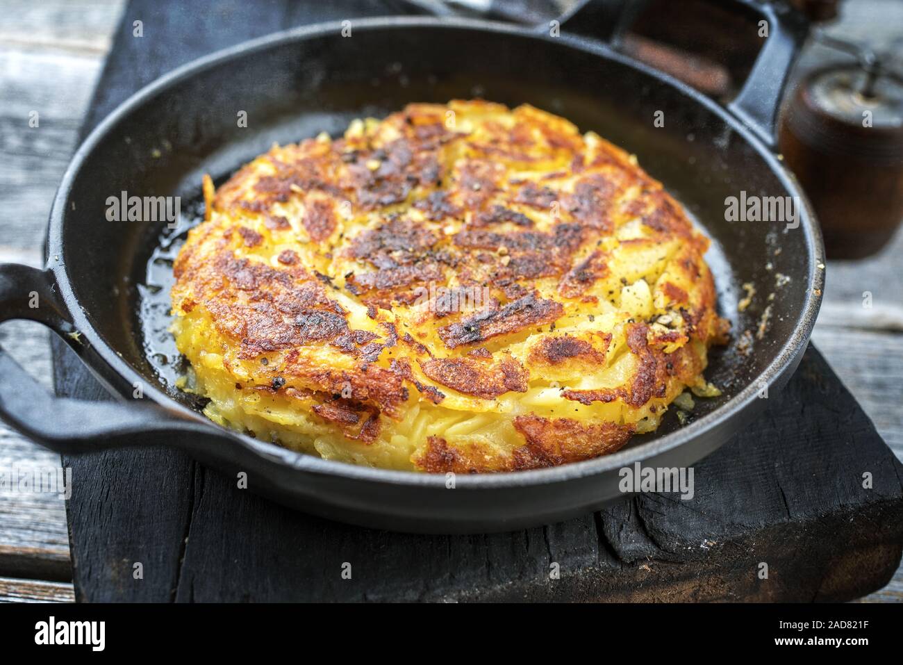 Traditional Swiss hash browns as side dish as closeup in a frying pan