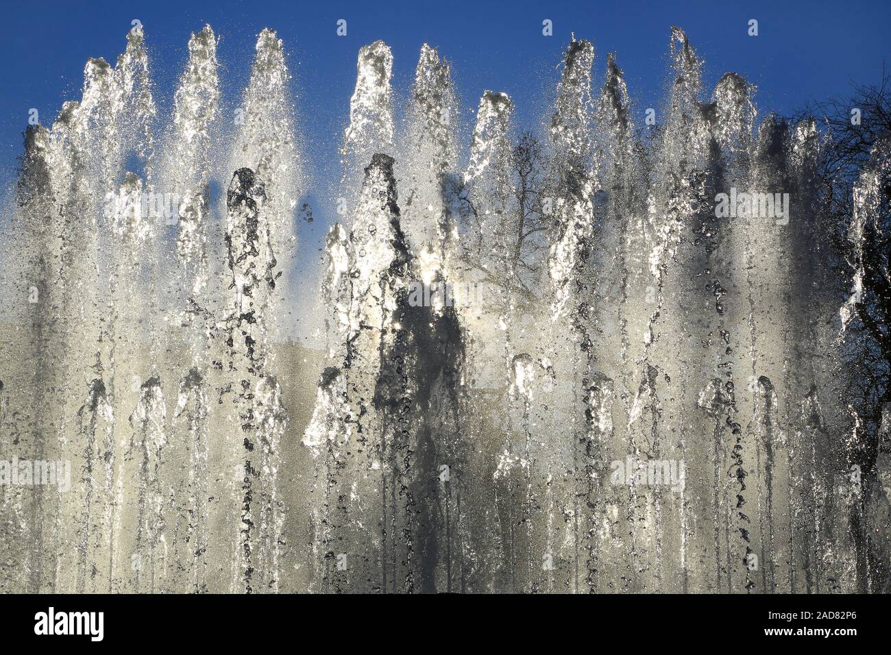 Milan, fountains of the fountain at the Castello Sforzesco in back light Stock Photo