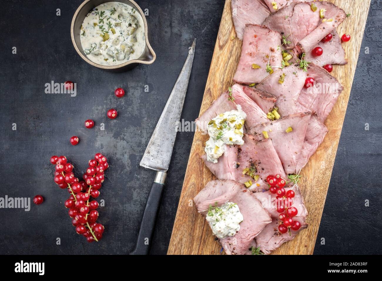 Traditional lunch meat with sliced cold cuts roast beef decorated with