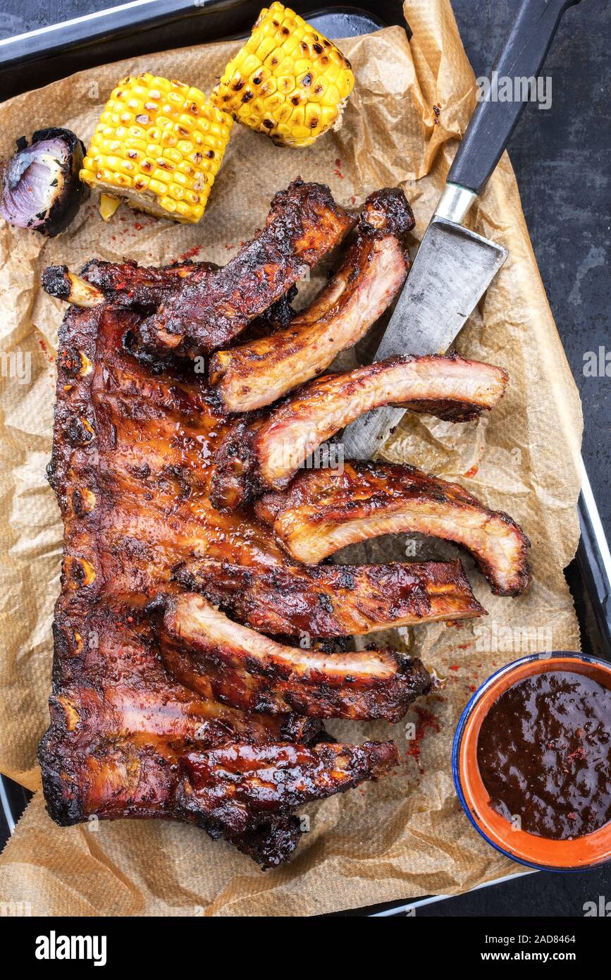 Barbecue spare ribs St Louis cut with hot honey chili marinade and corn
