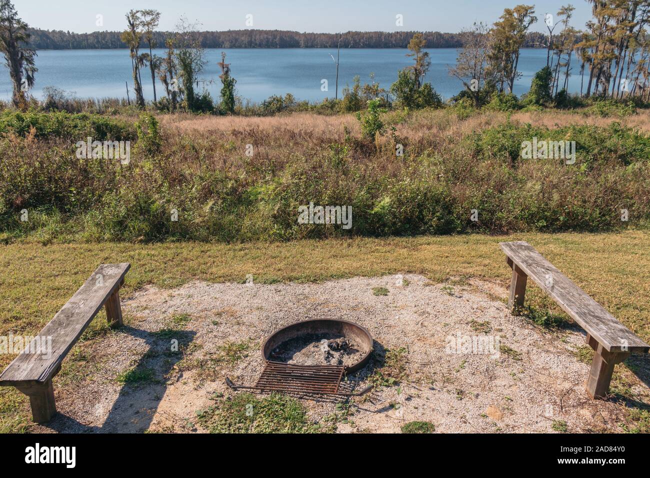 Lake Louisa State Park, Florida - Fire pit overlooking Dixie Lake from the cabin areas. Stock Photo
