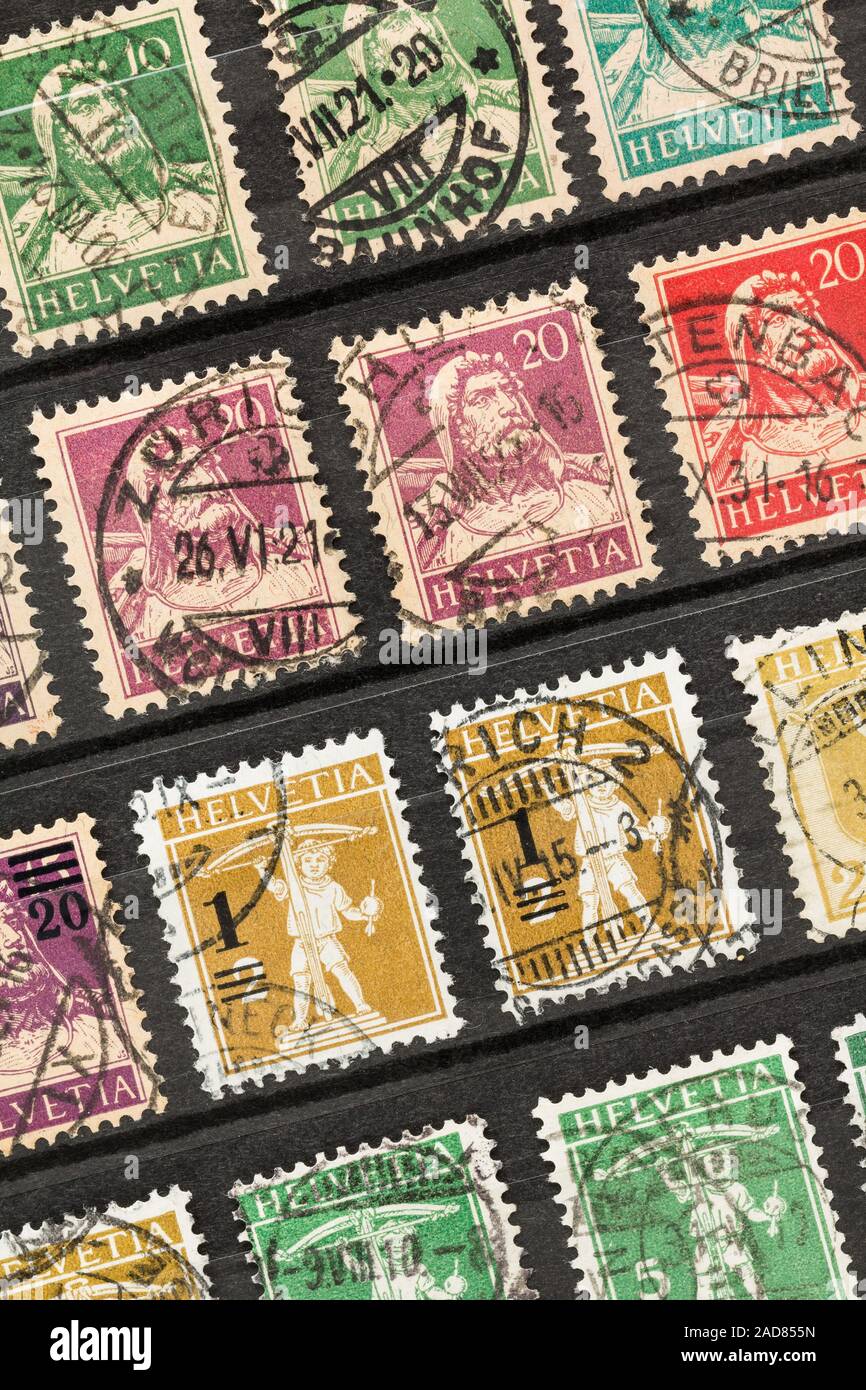 SEATTLE WASHINGTON - November 28, 2019: Close up of Swiss stamps in stock album featuring folklore hero William Tell and his son Walter. Stock Photo