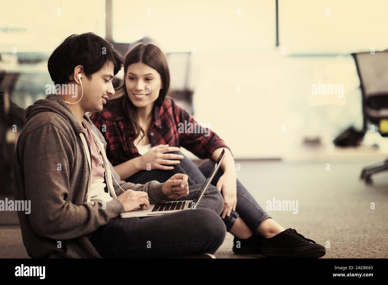 software developers couple working on the floor Stock Photo