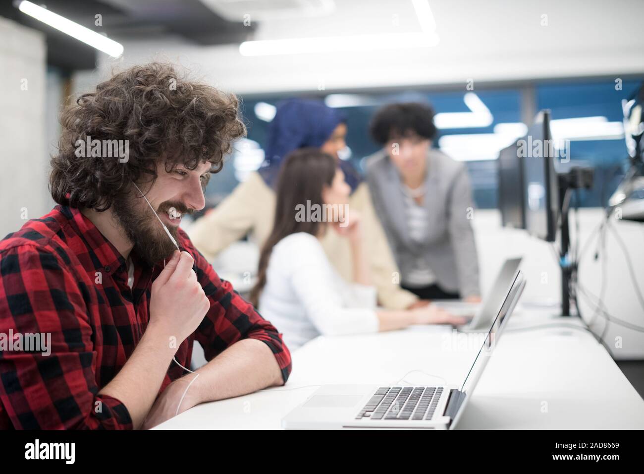 young multiethnics team of software developers working together Stock Photo