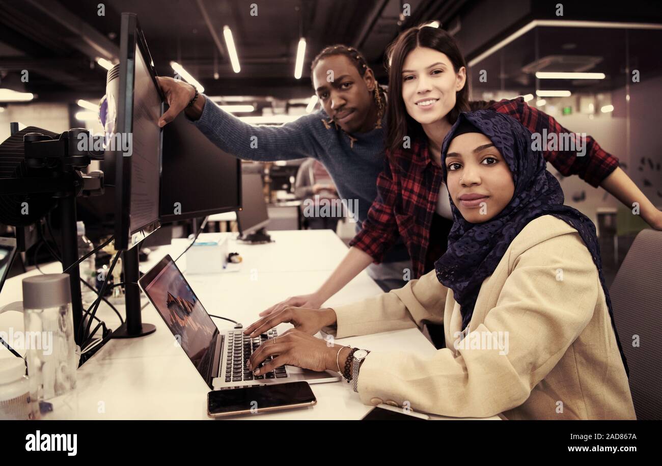 multiethnics team of software developers working together Stock Photo
