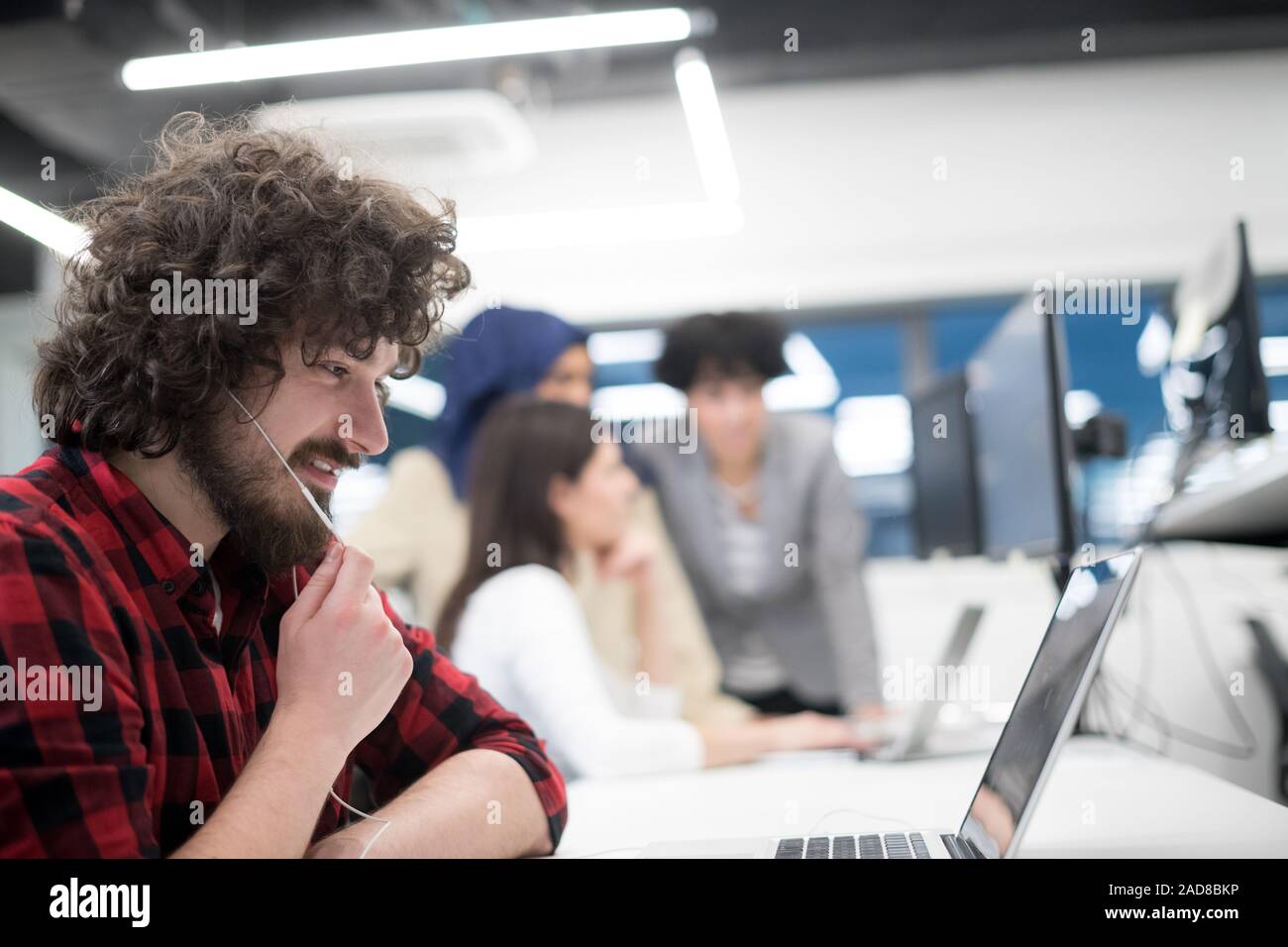 young multiethnics team of software developers working together Stock Photo