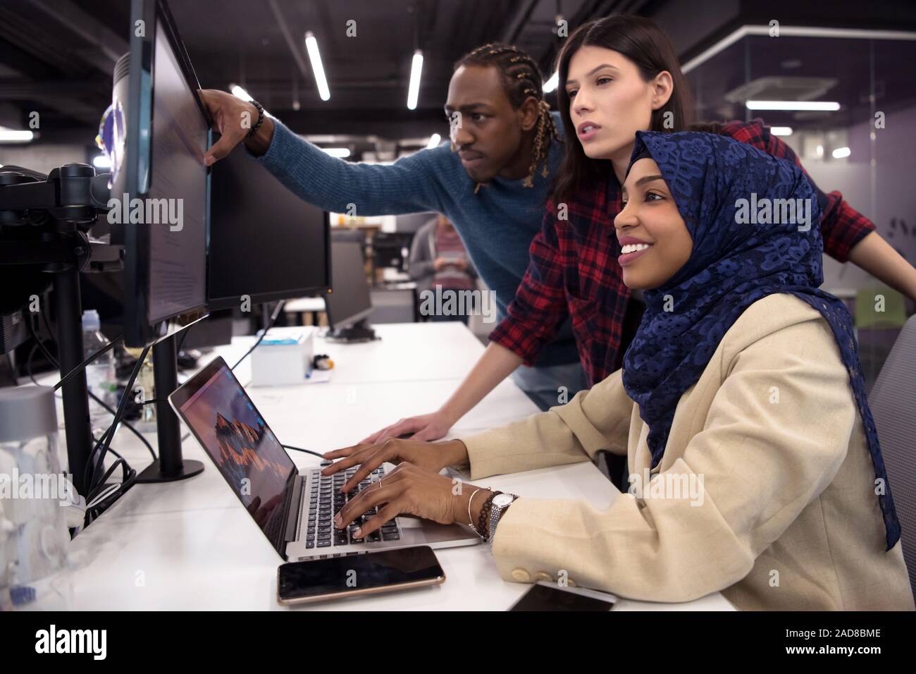 multiethnics team of software developers working together Stock Photo