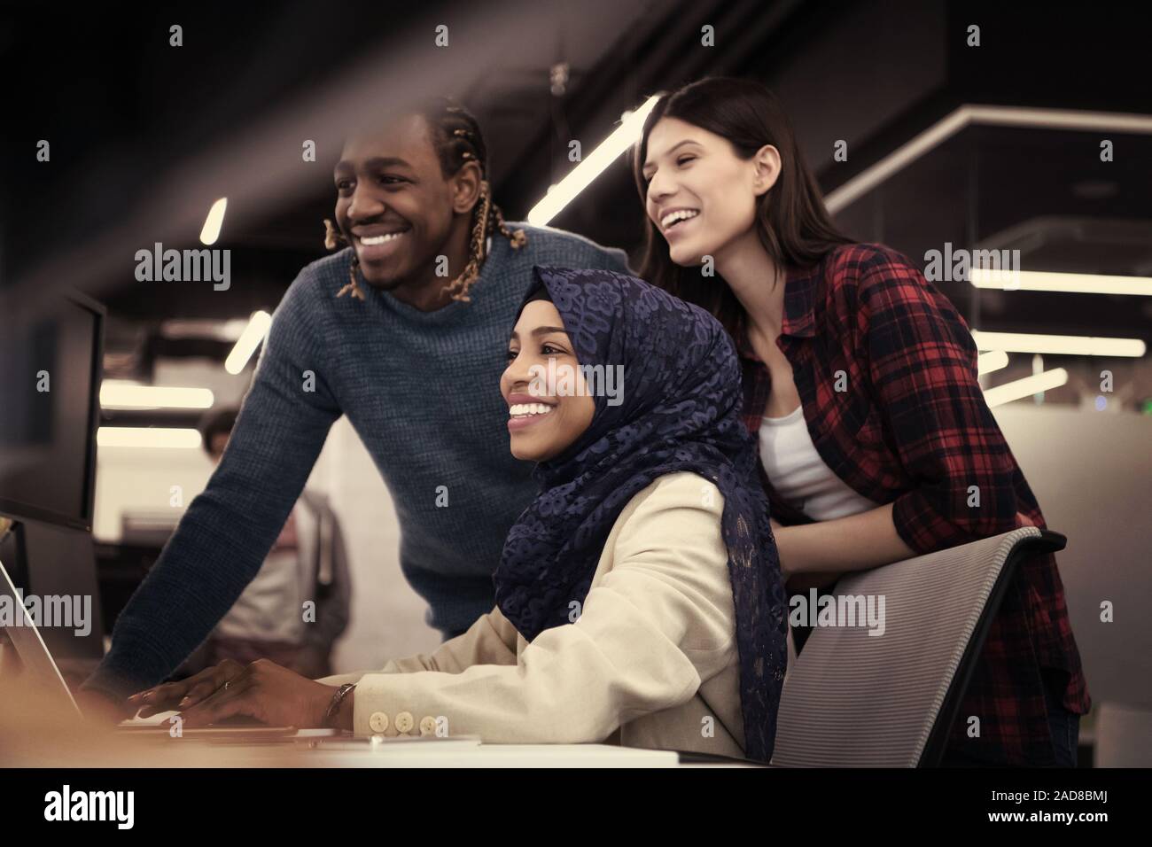 multiethnics team of software developers working together Stock Photo