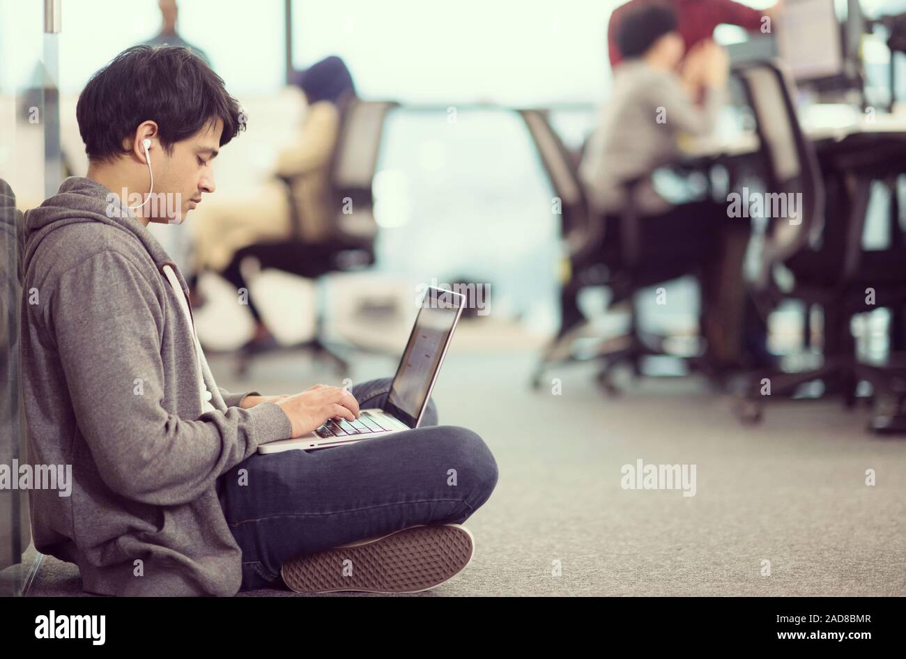 software developer working on the floor Stock Photo - Alamy