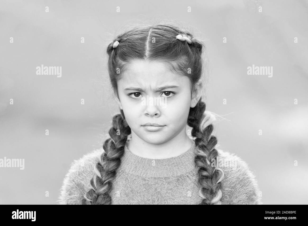 What is wrong. Hairdresser salon. Braided cutie. Little girl with cute  braids close up. Kanekalon strand in braids of child. Braided hairstyle  concept. Girl with braided hair style pink kanekalon Stock Photo -