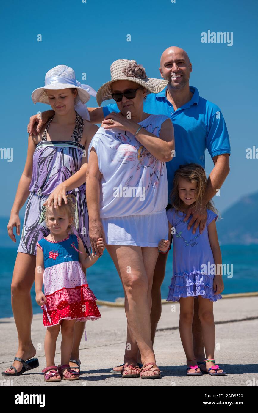 Portrait of happy multi generation family by the sea Stock Photo
