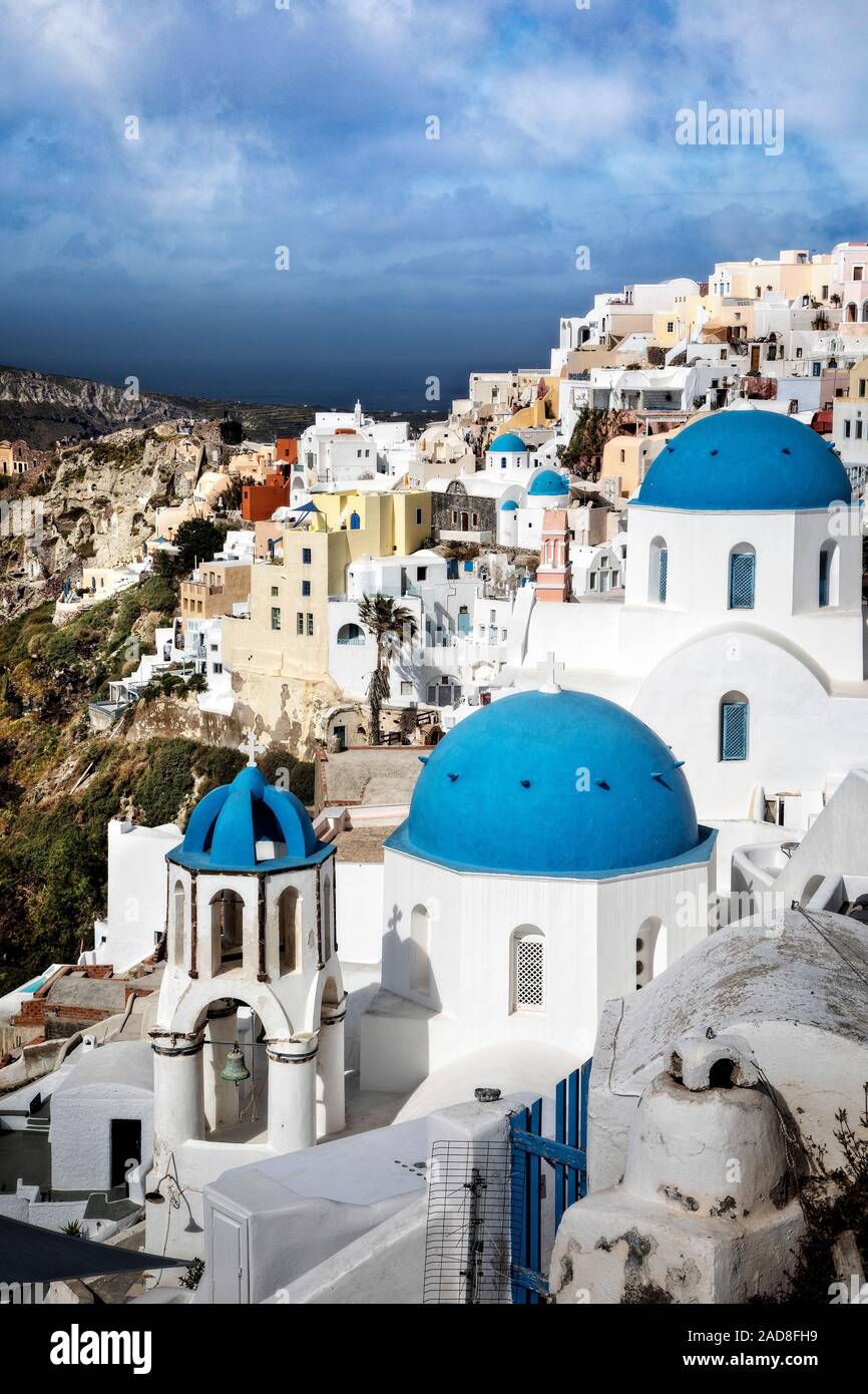 The village of Oia cascades down the caldera cliffs on Santorini, Greece. Stock Photo