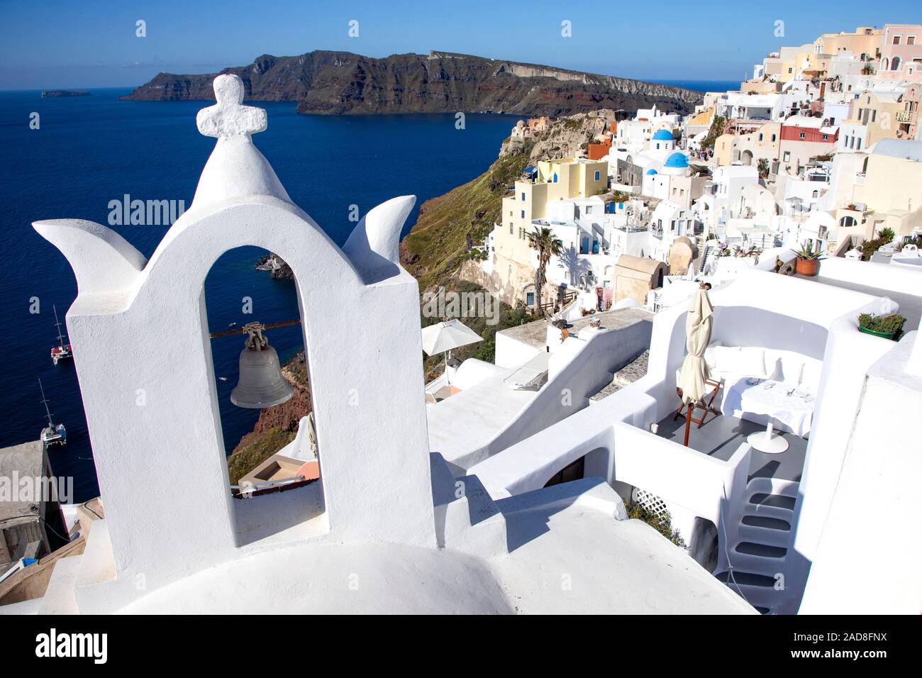 The village of Oia on Santorini, Greece cascades down the caldera cliffs. Stock Photo