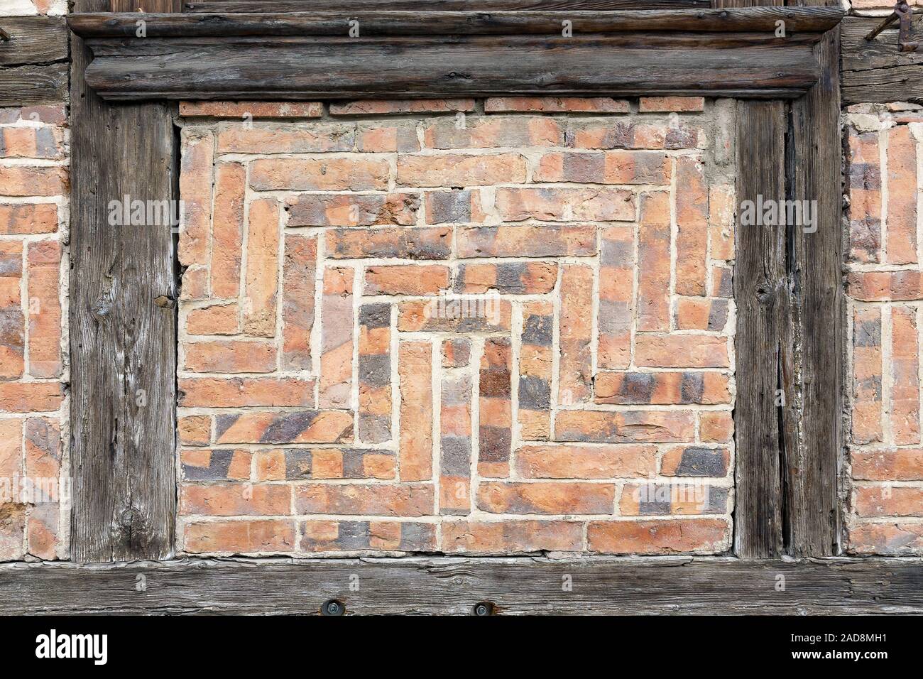 Bricks at a half-timbered house as background Stock Photo