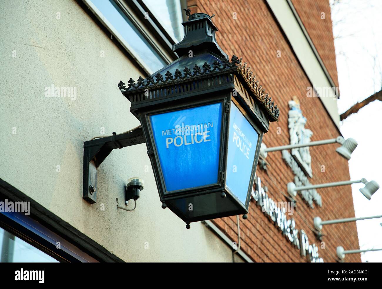 Metropolitan Police Lamp or Lantern with blue and white police logo. Chiswick Police Station. Stock Photo