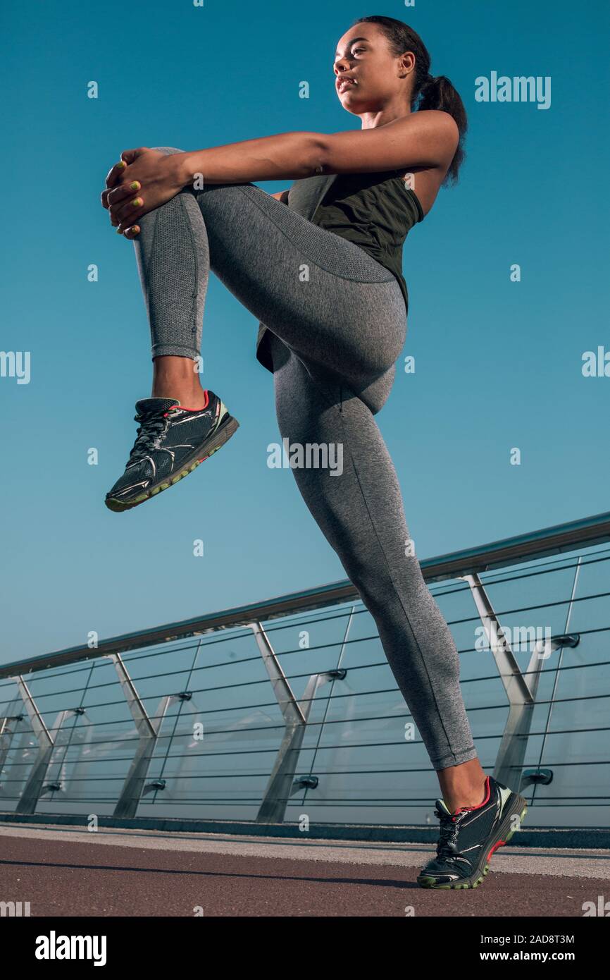 Woman pulling up tights hi-res stock photography and images - Alamy