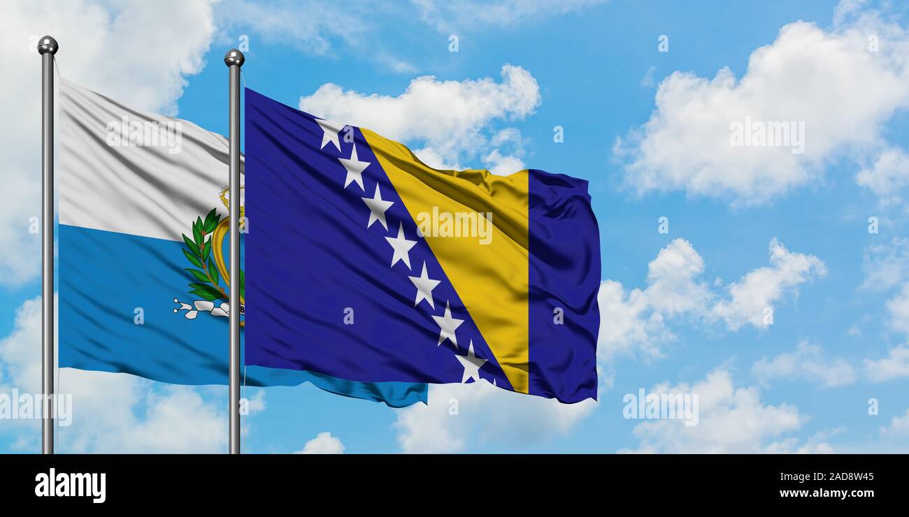 San Marino and Bosnia Herzegovina flag waving in the wind against white ...