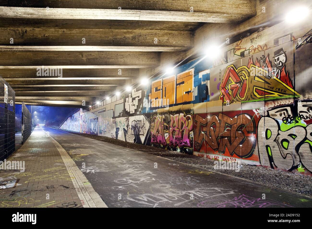 former railway line Nardbahntrasse, now pesestrian and cycle path in the evening, Wuppertal, Germany Stock Photo