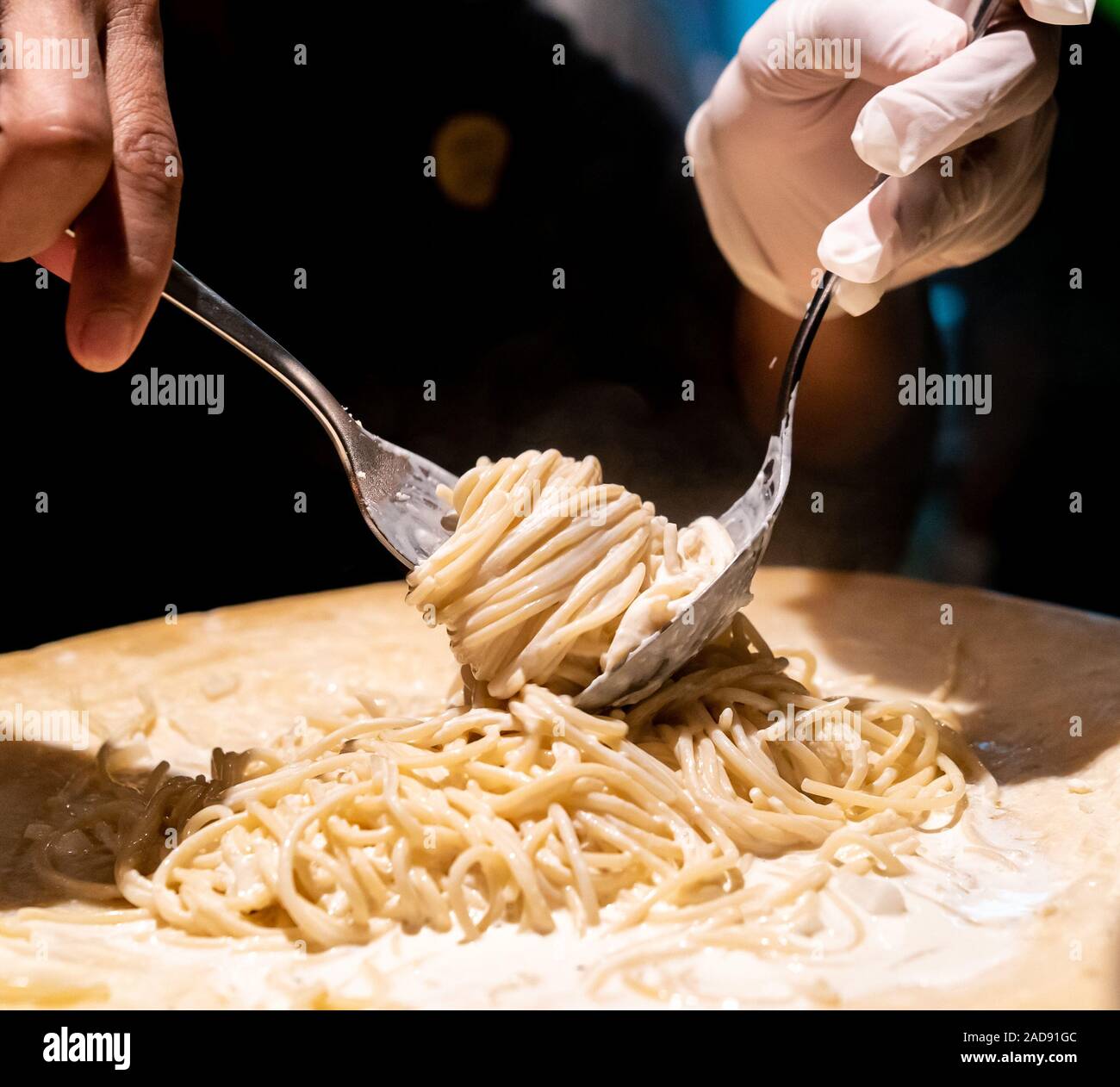 Pasta cooking in cheese bowl Stock Photo Alamy