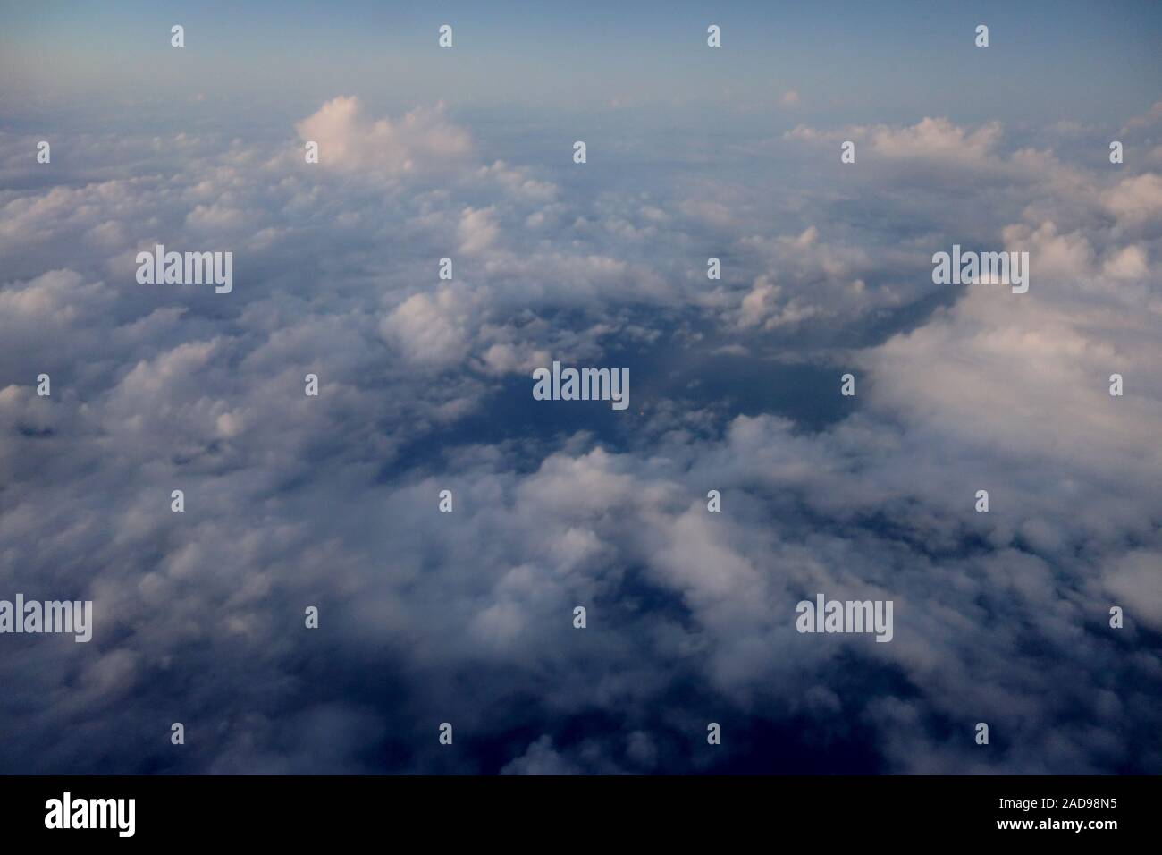 Aerial of Fluffy Clouds in a blue sky above Hawaii Stock Photo - Alamy
