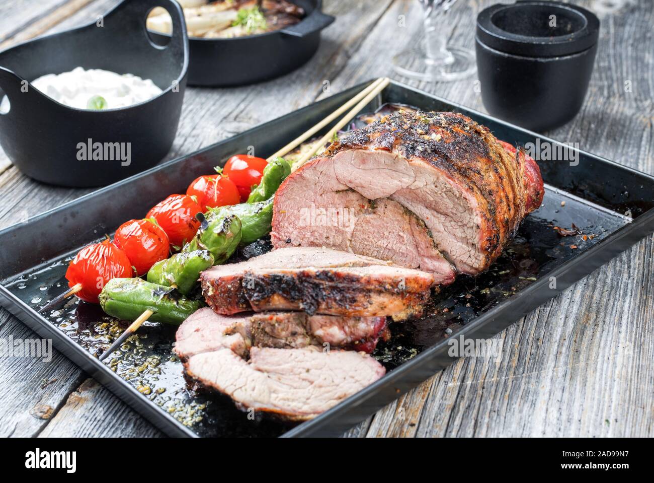 Barbecue marinated lamb roast with vegetable Stock Photo - Alamy