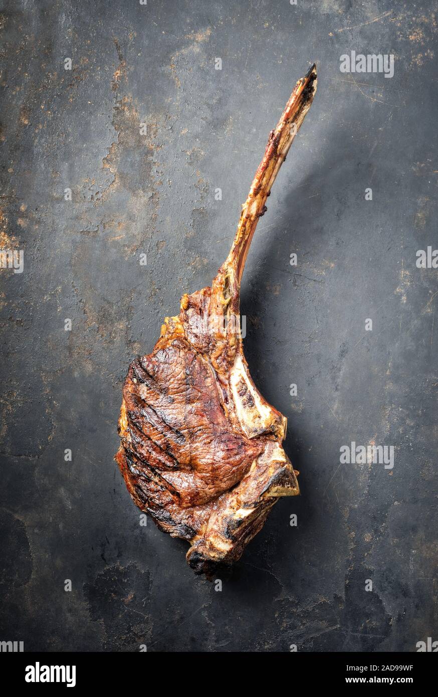 Traditional Barbecue Dry Aged Wagyu Tomahawk Steak As Top View On An Old Rustic Metal Sheet With