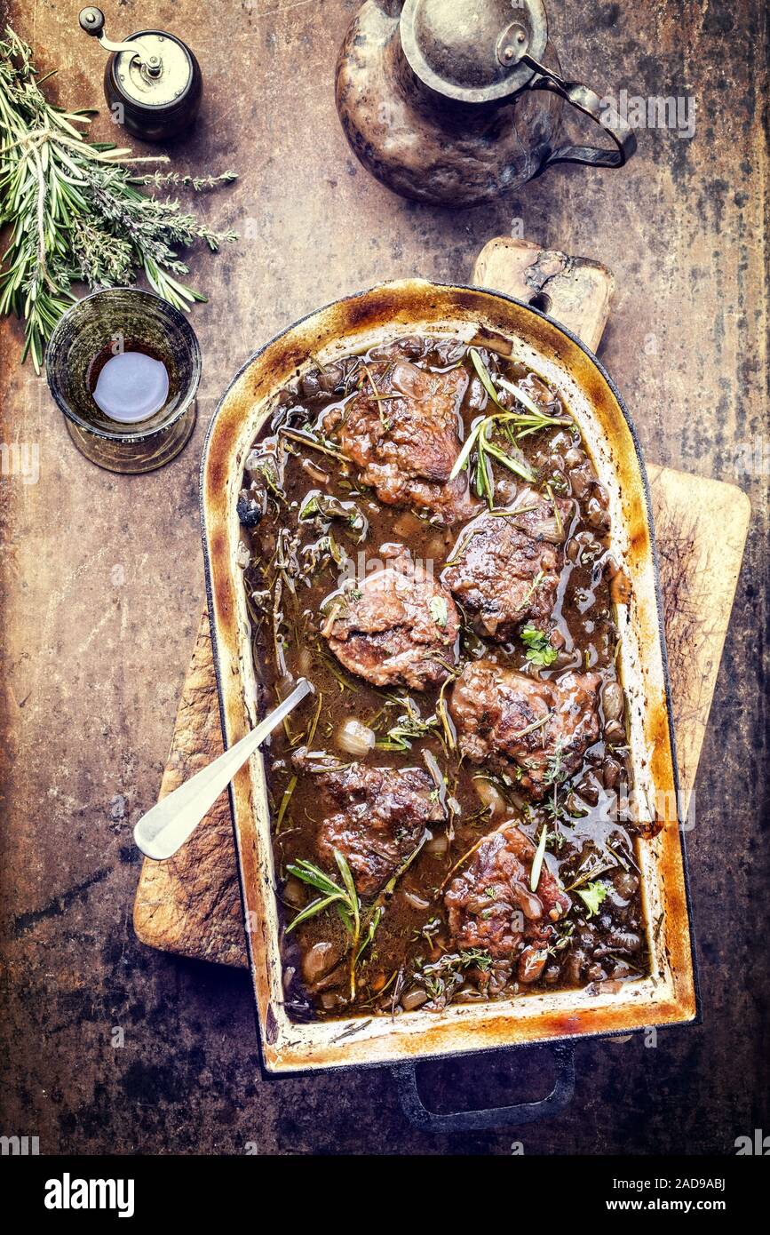 Traditional German braised veal cheeks in brown sauce with mushroom and