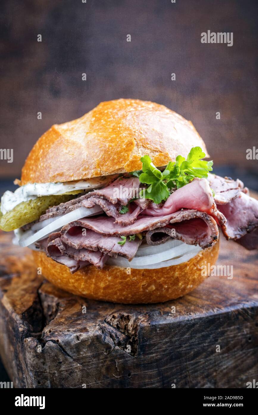 Traditional sliced cold cuts roast beef sandwich with onion Stock Photo