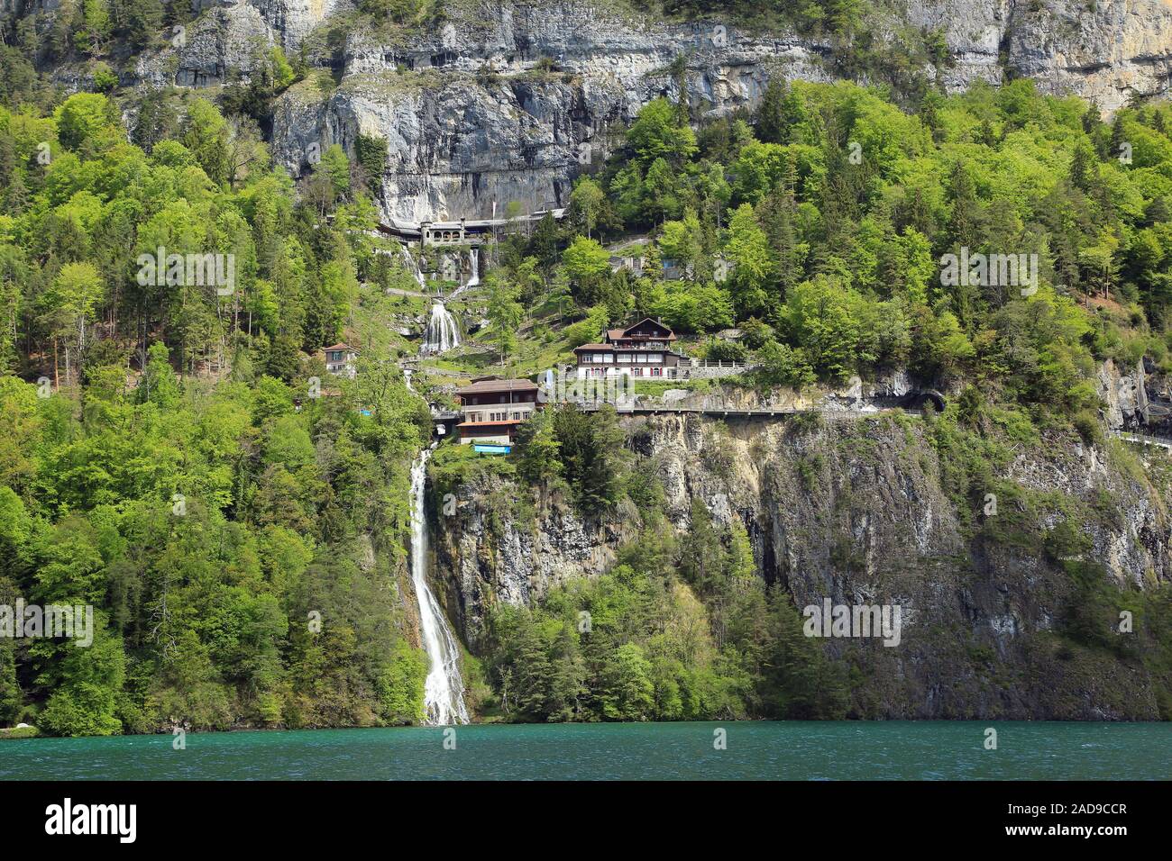 St. Beatus caves and lake road on the shore rocks near Beatenberg on Lake Thun, Switzerland Stock Photo